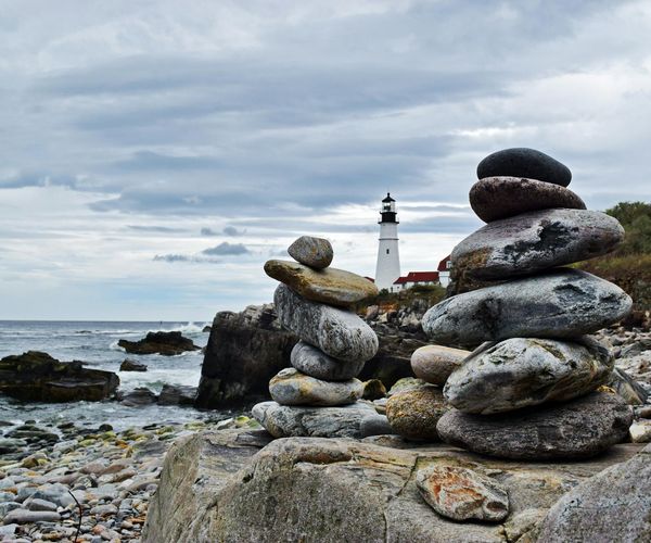 Balanced stones on a beach symbolizing harmony and stability.